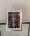 "On the Floor" - Mounted and Framed, Silver Frame. Overall size 9.4 inches tall by 7.4 inches wide.